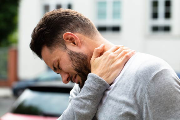 Patient experiencing neck pain and arm numbness from cervical spine nerve compression in Orland Park IL