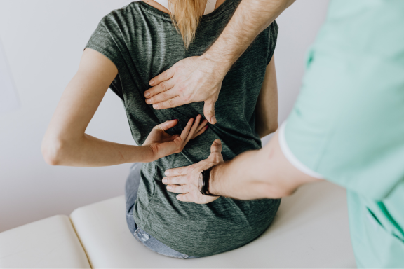 Patient exploring non-surgical back surgery alternatives for chronic back pain with an Orland Park spine specialist